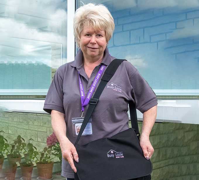 Woman standing next to a car
